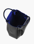 medium black leather tote bag purse with blue interior lining